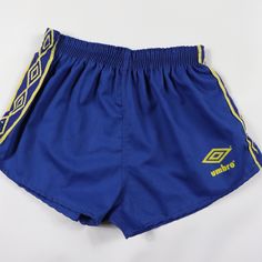 Vintage 80s Umbro Nylon Soccer Shorts Soccer Shorts Brand New Comes From A Smoke-Free Household. Youth Medium 2 Inch Inseam 11 Inch Waist Lying Flat 10 Inch Overall Length Youth Large 2 Inch Inseam 11.5 Inch Waist Lying Flat 10.5 Inch Overall Length Blue And Yellow 50% Cotton 50% Polyester Check Out My Other Items For Sale In My Store! Box 5 80s Athletic Fashion Men, Blue Stretch Vintage Bottoms, Vintage Stretch Blue Bottoms, Vintage Blue Stretch Bottoms, Blue Vintage Stretch Bottoms, Retro Blue Short Bottoms, Vintage Blue Sports Shorts, 80s Athletic Fashion, Brazil Soccer