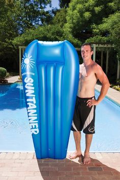 a man standing next to an inflatable swimming pool