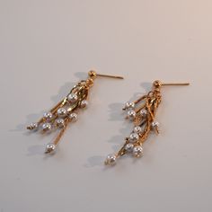 Instantly recognisable as a 1980s vintage piece and with lots of movement during wear, these faux pearl drop earrings are delicate with ultra shine thanks to their 18ct gold plated finish. Supplied with butterfly backs.  These earrings are genuine vintage, each piece will be unique and may have minor imperfections. Please note vintage jewellery is made from brass/copper/alloy metals and then plated with gold and therefore may contain nickel - those allergic to nickel should avoid allowing the jewellery making contact with the skin.  Delivered in a Gold Trip presentation box, perfect for gifting yourself or others. To prevent your Gold Trip jewellery from breaking or tarnishing easily, follow these simple tips, which will keep your jewellery looking shiny and intact for as long as possible: Vintage Range, Pearl Drop Earrings Gold, Tarnished Jewelry, June Birthstone Jewelry, Vintage Pearl, Zodiac Jewelry, Jewelry Ring Box, Pearl Jewellery Earrings, Vintage Pearls