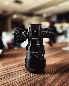 a camera on top of a wooden table