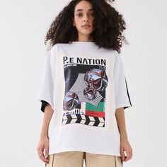 Pe Nation Manifesto Tee In Optic White Msrp $150 Nwt, Perfect Condition Size S Oversized Fit 100% Organic Cotton Sporty White Printed T-shirt, White Oversized Tops With Letter Print, White Graphic Print Top For Streetwear, Black Graphic Tee By Urban Outfitters, Oversized Graphic Print Top From Urban Outfitters, Urban Outfitters White T-shirt For Streetwear, Oversized Crew Neck Tops By Urban Outfitters, Oversized Crew Neck Top From Urban Outfitters, Sporty Oversized Top With Graphic Design