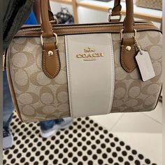 This Is A Brand New Coach Signature Bag Made Of Smooth And Recycled Leather. It Has Pockets And Belt Inside It As Shown In The Pictures. Measurements: Length: 10.0"; Height: 6.5"; Width: 5.5". Elegant Coated Canvas Satchel For Errands, White Satchel With Detachable Handle In Coated Canvas, White Coated Canvas Satchel With Detachable Handle, Elegant Coach Coated Canvas Satchel, Elegant Coated Canvas Satchel With Branded Hardware, Luxury Coach Satchel For Errands, Chic White Coated Canvas Satchel, Formal White Coated Canvas Bag, Designer Beige Satchel With Branded Hardware