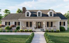 a white house with black shutters on the front porch and two story entryway