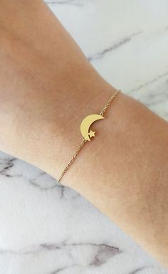 14K Gold Moon Star Bracelet, Solid gold bracelet, Dainty gold bracelet, Crescent moon bracelet, Gift for her, Star bracelet, Rose Gold Moon and Star bracelet, 9K Moon and star Bracelet, FREE EXPRESS SHIPPING Beautiful and delicate bracelet with a crescent moon and star charm made in 14K or 9K solid gold. Remember to reach for the moon and the stars, and they won't be able to resist flying into your hands! Whsiper...To the moon and back! -------------------------------------------------- D E T A Gold Charm Bracelet With Moon Charm As A Gift, Gold Celestial Charm Bracelet As A Gift, Gold Moon Charm Bracelet Jewelry, Gold Moon Charm Bracelet, Adjustable Gold Moon Bracelets, Adjustable Gold Bracelets With Moon Charm, Gold Celestial Bracelet For Gift, Celestial Gold Bracelet As Gift, Celestial Gold Bracelet For Gift