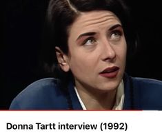 a woman with her mouth open in front of a black background and the words donna tart interview 922