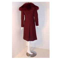 Description: Christian Dior 1971 three-piece burgundy wool coat set This is an Haute Couture three 4 piece ensemble by Christian Dior Haute Couture, from the winter collection 1971 Includes a burgundy wool double-breasted coat with two front open square pockets Fox fur collar Suede belt Provenance: Betsy Bloomingdale Coat Length: 42.5" Shoulder to shoulder: 14- 15 " Sleeve: 24.5" Bust: 34 - 36 " Waist: 38 " Hip: 40" Skirt Length: 25.5 Waist: 28" Hip: 36" Belt Length:31.5" Height: 2.5" Details: S Suede Belt, Christian Dior Haute Couture, Dior Haute Couture, Double Breasted Coat, Fur Collars, Wool Coat, Skirt Length, Winter Collection, Double Breasted