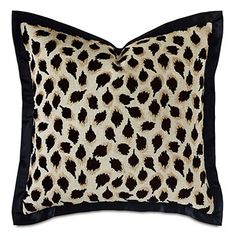 a leopard print pillow on a white background