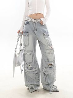 Experience the ultimate blend of streetwise flair and classic comfort with our Distressed Wide-Leg Denim Cargo Pants.

Made with premium denim, these pants boast a relaxed wide-leg fit and a natural waist design, providing a comfortable experience without compromising on style. The distressed details and multiple pockets echo a laid-back vibe while adding practicality and edge to your look. These versatile pants serve as the perfect canvas for a variety of styling options – pair them with a slee Luxury Pants For Spring Streetwear, Trendy Mid-rise Wide Leg Pants For Streetwear, Fall Streetwear Flare Jeans With Belt Loops, Wide Leg Cargo Jeans For Spring Streetwear, Spring Wide Leg Cargo Jeans For Streetwear, Fall Flare Jeans With Belt Loops For Streetwear, Casual Wide-leg Jeans With Belt Loops, Distressed Wide Leg Denim Blue Pants, Baggy Distressed Wide Leg Cargo Pants