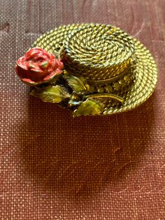 "RARE BSK Signed My Fair Lady Eliza Doolittle Basket Weave Flower Hat figural brooch. Quite the collector's item. This line was designed in 1962 and was sold in the movie theatres where \"My Fair Lady\" was featured. Signed \"BSK inside the hat and \"My Fair Lady\" on a cartouche on the inside of the brim. Beautiful and rare basket weave gold tone Eliza Doolittle hat framed with clear chatons with a focal point of a red enamel rose tipped in gold, green enamel leaves tipped in gold. Missing some Retro Flower Brooches For Collectors, Vintage Flower Lapel Pin Gift, Vintage Flower Lapel Pin For Gift, Vintage Handmade Collectible Pins, Handmade Vintage Brooches For Vintage Events, Vintage Collectible Lapel Pin Brooch, Vintage Flower Brooches For Vintage Events, Eliza Doolittle, Williamsburg Va