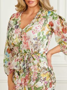 Summer Lantern Sleeve Blouse With Floral Print, Puff Sleeve Floral Blouse For Garden Party, Floral Print Long Sleeve Blouse For Garden Party, Printed V-neck Blouse For Daywear, V-neck Printed Blouse For Daywear, Feminine V-neck Blouse For Garden Party, Flowy Floral Print Blouse With Lantern Sleeves, Flowy Lantern Sleeve Blouse With Floral Print, Garden Party Puff Sleeve Floral Blouse