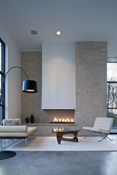 modern living room with fireplace and white furniture