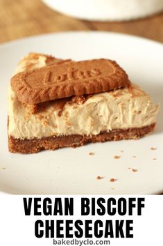 vegan biscoff cheesecake on a white plate with the words vegan biscoff cheesecake above it