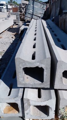 several cement blocks stacked on top of each other in the middle of a construction site