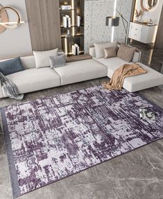 a living room with a large sectional couch and purple rug on the floor in front of it