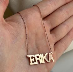 Rose gold necklace with block letter pendant spelling 'ERIKA'.  Preloved item Size (approx.): 8.5" long necklace, 1mm thick chain. Pendant: 3cm wide, 1cm tall Stamped 10KT on clasp and chain Weight: 2.816g **FREE shipping within Canada and USA** If you have any questions or concerns, please do not hesitate to contact us. We will be more than happy to help you and answer any inquiries.  We invite you to check out our shop for more fabulous items! Name Pendant, Birthday Name, Name Jewelry, Letter Pendants, Block Lettering, Gift For Birthday, Chain Pendant, Rose Gold Necklace, Spring Rings