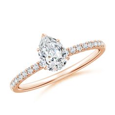 a rose gold engagement ring with a pear shaped diamond