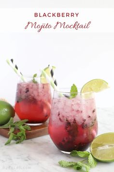 two glasses filled with mojito cocktails and lime slices