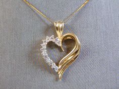 "THIS IS A VINTAGE ESTATE WOMEN'S 14K GOLD FINE NECKLACE AND 14K GOLD HEART PENDANT WITH DIAMOND CHIPS. NECKLACE MEASURES 16\" LONG. HEART PENDANT IS MARKED 14K GOLD AND MEASURES 3/4\" LONG X 3/4\" WIDE. TOTAL WEIGHT OF ITEM IS 5.35g. WOULD MAKE A LOVELY GIFT FOR THAT SOMEONE SPECIAL. ANY OTHER QUESTIONS, PLEASE ASK. BE SURE TO CHECK OUT SOME OF MY OTHER GREAT ITEMS UP FOR SALE. THANK YOU" Gold Heart Cut Diamond Necklace For Formal Occasions, Gold Heart-shaped Diamond Necklace For Weddings, Gold Heart Cut Diamond Necklace For Wedding, Elegant Yellow Gold Heart Necklace With Hallmark, Gold Heart Necklace With Diamond Cut For Formal Occasions, Formal Gold Heart Necklace With Diamond Cut, Gold Diamond Cut Heart Necklace For Formal Occasions, Gold Brilliant Cut Heart Necklace For Formal Occasions, Gold Brilliant Cut Heart Necklace For Formal Events