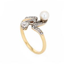 Finely detailed antique Edwardian diamond & pearl ''moi et toi'' ring crafted in 18k yellow gold (circa 1910s).    The old cushion cut diamond is estimated at 0.25 carats, accented with a further 23 estimated 0.01 carat rose cut diamonds. The total diamond weight is estimated at 0.48 carats (estimated at J-K colour and I1-2 clarity). The pearl measures 5.3mm.   The distinct and stylish ring is a great example of Edwardian era jewellery. The two stone diamond & pearl ''Moi et Toi'' design is a Fr Antique Yellow Gold Pearl Ring With Rose Cut Diamonds, Victorian Pearl Ring With Gold And Diamond, Classic Pearl Ring With Diamonds For Gifts, Classic Pearl Ring With Single Cut Diamonds As Gift, Classic Pearl Ring With Single Cut Diamonds For Gift, Vintage White Pearl Ring With Brilliant Cut, Classic Pearl Ring With Single Cut Diamonds For Wedding, Heirloom White Gold Pearl Ring With Rose Cut Diamonds, Classic Diamond Pearl Ring Hallmarked