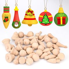 wooden ornaments are hanging from strings and on the string is a bell ornament