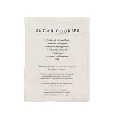 a white tea towel with the words sugar cookies on it