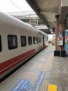 the train is stopped at the station waiting for passengers to get on or off it