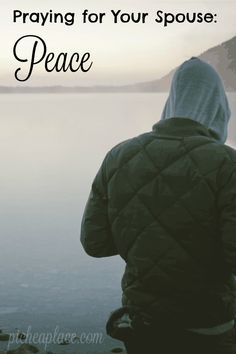 a person in a green jacket looking out over water with the words praying for your spouse peace