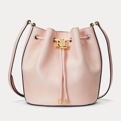 Lauren Ralph Lauren Leather Medium Andie Drawstring Bucket Bag, Light Pink New With Tag, Retail $295 Details From Site: The Handy Andie 19 Drawstring Medium Light Pink Bucket Bag By Lauren Ralph Lauren Combines A Chic And Classic Look. Even Texture Consisting Of Smooth Leather In Beige Provides A Luxurious Character Inner Material Consists Of Practical, Beige Textile With Brand Logo Appealing Gold Colored Metal Details Adjustable Shoulder Strap Made Of Robust Leather For Good Grip As Well As An Ralph Lauren Bags, Ralph Lauren Leather, Drawstring Bucket Bag, Bag Light, Pink Bag, Lauren Ralph Lauren, Smooth Leather, Pink And Gold, Bucket Bag