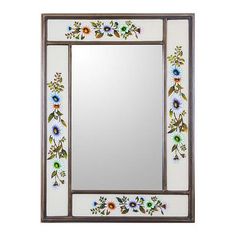 a decorative mirror with flowers painted on the side and an ornate border around the edge