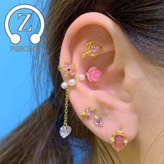 the ear is decorated with pink and white stones