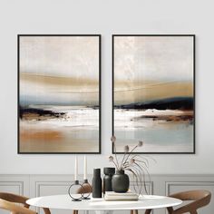 two paintings hanging on the wall above a dining room table with chairs and vases