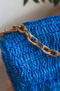 The Laura Flap bag is the perfect crossbody bag to take with you on all your adventures! Crafted from inviting woven straw, it's adorned with a touch of luxe from gold hardware and an adjustable chain strap. Open it up to find a fabric-lined interior, complete with one zipper pocket for extra security and one slip pocket for quick access to the essentials. Take Laura along on date night or when you need a roomy companion during errands - she's sure to be your new favorite accessory! Item Type: C Beach Crossbody Bag With Chain Strap, Vacation Crossbody Bag With Chain Strap, Everyday Straw Shoulder Bag With Chain Strap, Trendy Blue Straw Bag With Adjustable Strap, Gold Crossbody Shoulder Bag For Beach, Gold Crossbody Bag For Beach, Gold Beach Bag With Chain Strap, Trendy Gold Woven Bag, Crossbody Straw Bag With Gold-tone Hardware For Travel