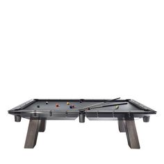 a pool table with cues and balls on the top, in front of a white background