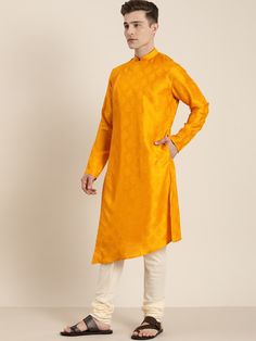 SHRESTHA BY VASTRAMAY Men's Yellow Angrakha Kurta Set Embrace heritage style with this men's yellow angrakha kurta and pyjama set. The kurta features a woven design, a mandarin collar, long sleeves, and an asymmetric hem. The solid pyjamas ensure a comfortable fit. Key Features Woven design yellow kurta Mandarin collar Long sleeves Angrakha style Asymmetric hem Solid cream pyjamas Specifications: Sleeve Length - Long Sleeves Top Shape Straight Neck Mandarin collar Print or Pattern Type - Woven D Yellow Long Sleeve Bandhgala For Festive Occasions, Yellow Long Sleeve Festive Bandhgala, Festive Yellow Long Sleeve Bandhgala, Traditional Yellow Kurta With Naqshi, Traditional Yellow Naqshi Kurta, Yellow Sherwani For Puja And Eid, Yellow Naqshi Traditional Wear For Diwali, Yellow Sherwani For Eid Puja, Yellow Long Sleeve Bandhgala For Diwali