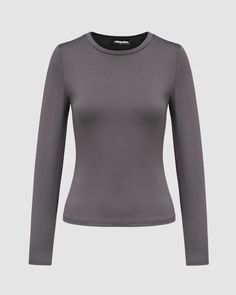 a women's grey top with long sleeves and a round neck, on a gray background