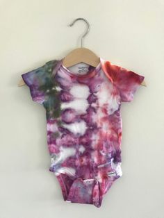 >> hand dyed, short sleeve baby bodysuit in 18 month size << beautiful + unique. 100% cotton garment made using an ice dye technique, which creates a one of a kind watercolor effect. consciously made by hand with love, using non-toxic dyes + recycled garments / no two pieces are alike.  machine wash in cold water on gentle cycle, hang dry.  item in product photo(s) is exact piece you will receive.  enjoy! Multicolor Short Sleeve Onesie For Summer, Fitted Multicolor Cotton Bodysuit, Unisex Cotton Bodysuit For Summer, Multicolor Short Sleeve Cotton Bodysuit, Multicolor Cotton Short Sleeve Bodysuit, Unisex Cotton Onesie For Summer, Unisex Short Sleeve Bodysuit For Spring, Multicolor Cotton Onesie For Summer, Summer Multicolor Cotton Onesie