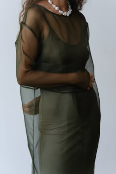 The Organza Dress is crafted from 100% silk and features, piping details throughout, side slits at the bottom, and a boxy fit. 
Please note this is a sheer style as intended. We love to layer it with The Jersey Slip Dress for coverage. 
Made in Los Angeles Silk Overlay Dress, Sheer Silk Dress, Sheer Dress Outfit, Insect Dress, Organza Outfit, Organza Fashion, Sheer Overlay Dress, Dress Layering, Dress Organza