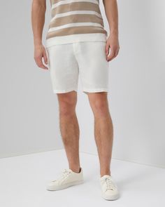 Ease of wear meets a crisp, tailored fit on our Linen Fixed Waist Short. The pair is cut to a versatile 7 ½" inseam, with streamlined finishes, including front and back pockets, a zip fly with a button-front closure, and belt loops in addition to adjustable buckled tabs. The Linen Fixed-waist Short pairs well with the Cotton Textured Knit Polo and the Shaun Linen Polo. White Semi-formal Bottoms With Welt Pockets, Semi-formal White Bottoms With Welt Pockets, Slim Fit Bottoms With Straight Hem For Summer, Classic Semi-formal Short Bottoms, Slim Fit Linen Casual Bottoms, White Flat Front Bottoms For Business Casual, Classic Slim Fit Summer Bottoms, White Flat Front Bottoms With Welt Pockets, White Slim Fit Bottoms With Straight Hem