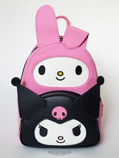 This is a Loungefly Hello Kitty - My Melody and Kuromi mini backpack.  This smooth and supple leather backpack features My Melody and Kuromi cosplay characters in pink and black with glitter and embroidered faces.  The backpack is lined in pink fabric with a print of My Melody and Kuromi.  A zippered pouch reside behind Kuromi and convenient drop pockets are on each side.  The padded shoulder straps are adjustable and the sturdy hardware is gold chrome.  A beautiful backpack!  Check out our list Kuromi Cosplay, Kuromi Outfit, Sanrio Room, Embroidered Faces, My Melody And Kuromi, Melody And Kuromi, Loungefly Hello Kitty, Beautiful Backpacks, My Melody Kuromi