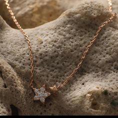 Description You will be reminded of your birth star every time you choose to wear the Estrella Minimal Necklace. It is rose gold plated in high polish with a little, twinkling star motif adding to this jewelry's celestial charm. Wear it by itself or layer it with other necklaces for a more glamorous look. Product Information Materials used: 925 Silver with White Rose Gold Plating Stones: High Grade CZ Stones Length: 21 cm and adjustable Findings: Hook and links Rose Gold Celestial Jewelry With Star Charm, Celestial Rose Gold Jewelry With Star Charm, Minimalist Rose Gold Star Charm Jewelry, Celestial Rose Gold Star Jewelry, Celestial Rose Gold Cubic Zirconia Jewelry, Dainty Sparkling Star Jewelry, Dainty Sparkling Star-shaped Jewelry, Elegant Rose Gold Necklace With Star Charm, Dainty Rose Gold Jewelry With Star Charm