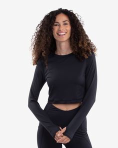 Women wearing black everyday crop top with black leggings. (Style 4015) - BloqUV Black Breathable Sports Crop Top, Summer Yoga Crop Top With Moisture-wicking, Fitted Surfing Tops With Upf 50+, Summer Yoga Moisture-wicking Crop Top, Black Moisture-wicking Crop Top For Yoga, Capri Sun, Beach Tennis, Sun Shirt, Upf 50