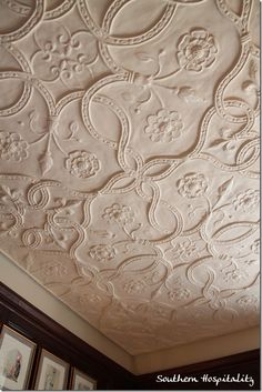 an ornate ceiling with white paint on it