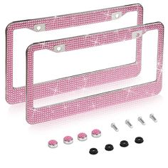 two pink license plates with screws and studs on the bottom one has a white background