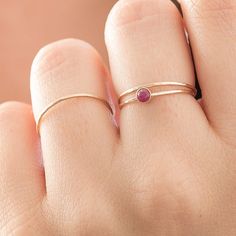 Adjustable Ruby Birthstone Ring, Fine Jewelry, Adjustable Ruby Birthstone Ring In Fine Jewelry Style, Stackable Double Band Promise Jewelry, Adjustable Simple Design Rings For Promise, Stackable Double Band Rings As Gift, Stackable Double Band Rings For Gift, Adjustable Simple Stackable Rings For Promise, Dainty Adjustable Ruby Jewelry, Adjustable Dainty Ruby Jewelry