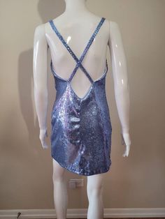 "Inspired by Dua Lipa's song \"Levitating\" It is made with a cornflower blue stretch sequin fabric. 100% lined 4 Rhinestone ornaments on the straps The skirt length from waist to hem is approximately 17\" and about 4\" above the knee (If you would like the skirt a little longer please contact me. Made to Order Sizes: Bust XS- 31-33\" Bust S- 34-36\" Bust M- 37-39\" Bust L- 40-41\" Bust Waist XS- 25-26\" waist S- 27-28\" waist M- 29-30\" waist L- 31-32\" waist Hips XS- 33-34 S- 35-36 M- 37-40 L- Dua Lipa Levitating, Bowie Ziggy Stardust, Rhinestone Ornaments, David Bowie Ziggy, Ziggy Stardust, Multicolor Dress, Dua Lipa, Sequin Fabric, Inspired Dress