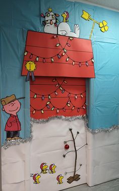 a bulletin board is decorated with peanuts and charlie brown's christmas lights on it