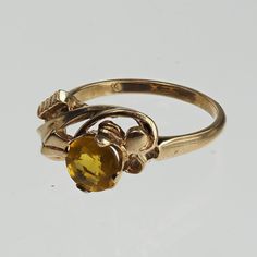 Vintage 1940s 10k gold yellow stone ring. The band has a twist design around the stone. It is a size 6 and can be sized. Yellow Stone Ring, Baguette Diamond Wedding Band, Yellow Stone Rings, Gold Diamond Engagement Rings, Yellow Stone, Pretty Rings, Boston Ma, Baguette Diamond, Stone Ring