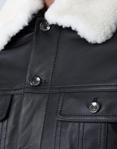 Expertly crafted by Dolce & Gabbana, this quilted lambskin jacket boasts patch pockets, a luxurious fur collar, and secure button fastening. Its sophisticated design premium materials ensure both style functionality. Elevate your wardrobe with timeless piece. Luxury Leather Outerwear With Pockets, Luxury Leather Jacket With Flap Pockets, Classic Sheepskin Leather Jacket With Padded Collar, Luxury Shearling Leather Jacket For Work, Designer Shearling Leather Jacket With Padded Collar, Luxury Quilted Leather Jacket With Long Sleeves, Designer Winter Outerwear With Flap Pockets, Luxury Sheepskin Leather Jacket With Long Sleeves, Luxury Long Sleeve Sheepskin Leather Jacket