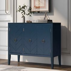 a blue cabinet sitting in the corner of a room with a potted plant on top