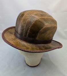 Handmade and hand stitched leather bowler hat is sized at 22.5 inches on the inside with a little stretch.  If you have any questions please message before purchase. Brown Leather Brimmed Fedora, Fitted Leather Hat With Curved Brim, Fitted Leather Fedora Hat, Fitted Brown Leather Fedora, Fitted Leather Hat With Short Brim, Classic Leather Top Hat With Short Brim, Fitted Leather Top Hat With Short Brim, Vintage Leather Fedora For Rodeo, Fitted Leather Top Hat With Flat Brim